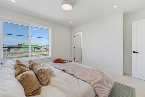 2465 Creeker Lane, Airdrie, AB - Indoor Photo Showing Bedroom