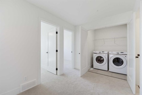 2465 Creeker Lane, Airdrie, AB - Indoor Photo Showing Laundry Room