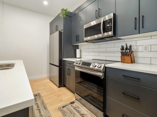 641 Blackwolf Boulevard North, Lethbridge, AB - Indoor Photo Showing Kitchen With Double Sink With Upgraded Kitchen