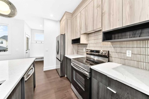 2473 Creeker Lane, Airdrie, AB - Indoor Photo Showing Kitchen With Upgraded Kitchen
