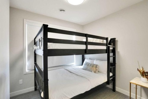 206-109 Kananaskis Way, Canmore, AB - Indoor Photo Showing Bedroom