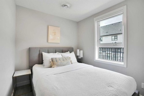 206-109 Kananaskis Way, Canmore, AB - Indoor Photo Showing Bedroom