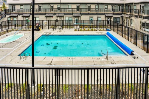 206-109 Kananaskis Way, Canmore, AB - Outdoor With In Ground Pool