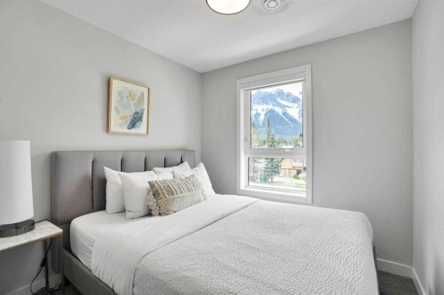 206-109 Kananaskis Way, Canmore, AB - Indoor Photo Showing Bedroom