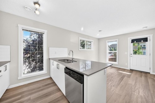 428 Cranbrook Square Se, Calgary, AB - Indoor Photo Showing Kitchen With Double Sink