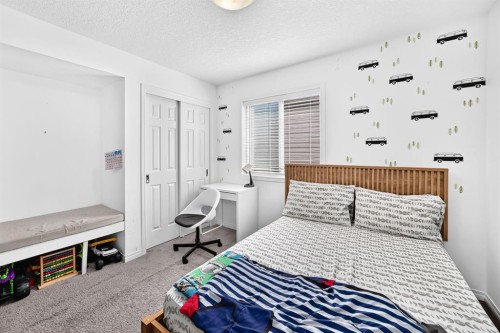 446 Windrow Common Sw, Airdrie, AB - Indoor Photo Showing Bedroom