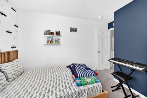446 Windrow Common Sw, Airdrie, AB - Indoor Photo Showing Bedroom