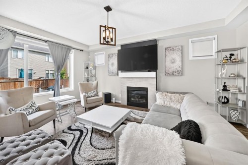446 Windrow Common Sw, Airdrie, AB - Indoor Photo Showing Living Room With Fireplace