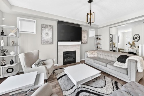 446 Windrow Common Sw, Airdrie, AB - Indoor Photo Showing Living Room With Fireplace