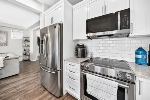 446 Windrow Common Sw, Airdrie, AB - Indoor Photo Showing Kitchen With Stainless Steel Kitchen