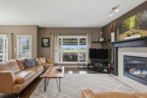 69 Everhollow Avenue Sw, Calgary, AB - Indoor Photo Showing Living Room With Fireplace