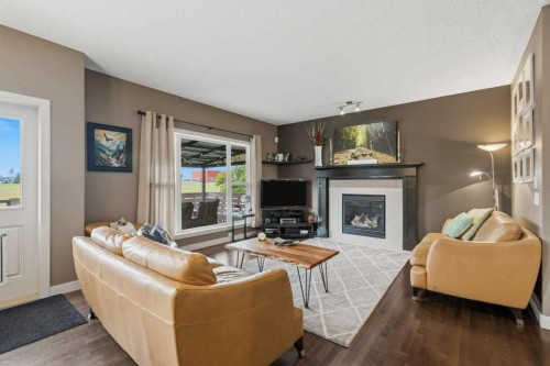 69 Everhollow Avenue Sw, Calgary, AB - Indoor Photo Showing Living Room With Fireplace