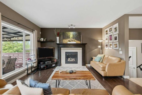 69 Everhollow Avenue Sw, Calgary, AB - Indoor Photo Showing Living Room With Fireplace