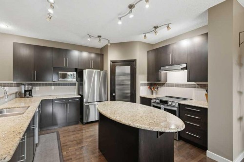 69 Everhollow Avenue Sw, Calgary, AB - Indoor Photo Showing Kitchen With Double Sink With Upgraded Kitchen