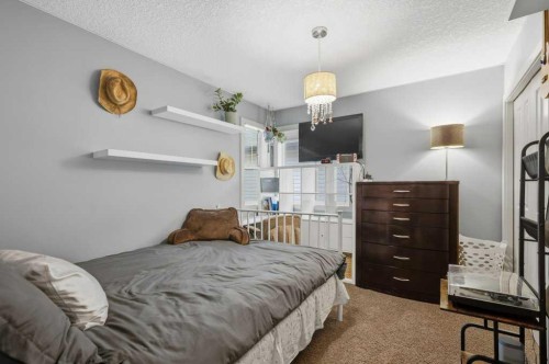 69 Everhollow Avenue Sw, Calgary, AB - Indoor Photo Showing Bedroom