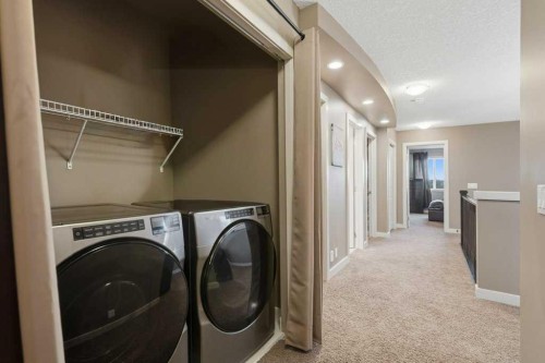 69 Everhollow Avenue Sw, Calgary, AB - Indoor Photo Showing Laundry Room
