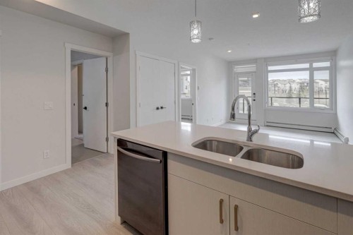 110-214 Sherwood Square Nw, Calgary, AB - Indoor Photo Showing Kitchen With Double Sink