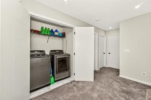 23 Lucas Boulevard Nw, Calgary, AB - Indoor Photo Showing Laundry Room