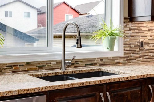 2620 Reunion Square Nw, Airdrie, AB - Indoor Photo Showing Kitchen With Double Sink