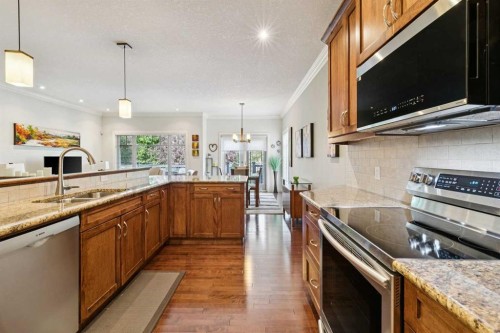 64 Bridle Estates Place Sw, Calgary, AB - Indoor Photo Showing Kitchen With Stainless Steel Kitchen With Double Sink With Upgraded Kitchen