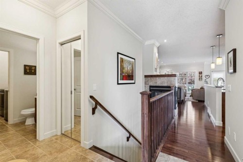 64 Bridle Estates Place Sw, Calgary, AB - Indoor Photo Showing Other Room With Fireplace