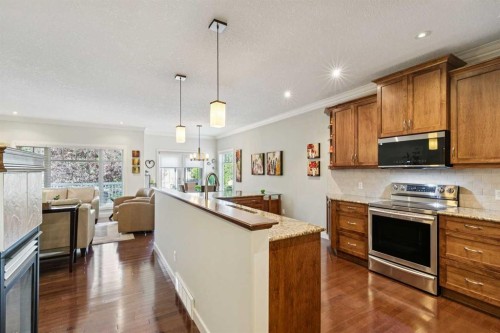 64 Bridle Estates Place Sw, Calgary, AB - Indoor Photo Showing Kitchen With Stainless Steel Kitchen