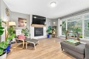 106 Autumn Crescent Se, Calgary, AB  - Indoor Photo Showing Living Room With Fireplace 