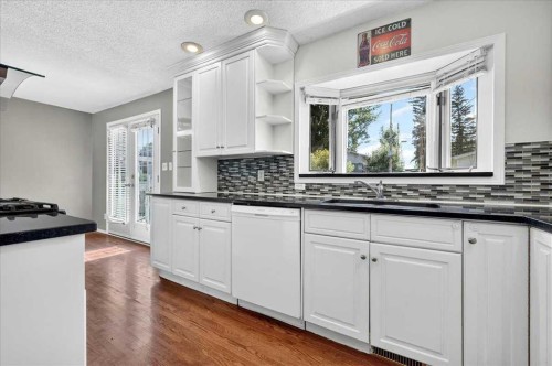 4711 Montana Drive Nw, Calgary, AB - Indoor Photo Showing Kitchen With Double Sink