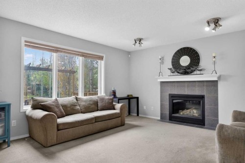 112 Valley Stream Close Nw, Calgary, AB - Indoor Photo Showing Living Room With Fireplace