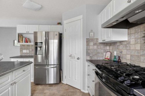 112 Valley Stream Close Nw, Calgary, AB - Indoor Photo Showing Kitchen With Stainless Steel Kitchen With Upgraded Kitchen