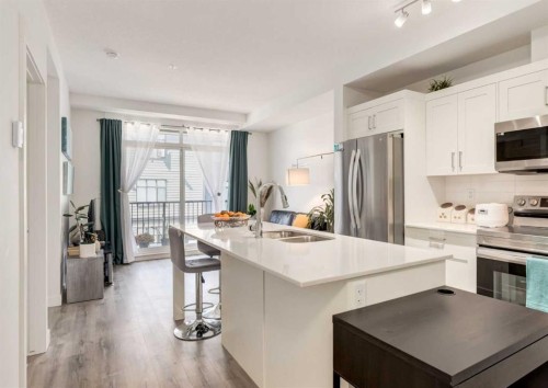 311-30 Sage Hill Nw, Calgary, AB - Indoor Photo Showing Kitchen With Stainless Steel Kitchen With Double Sink With Upgraded Kitchen
