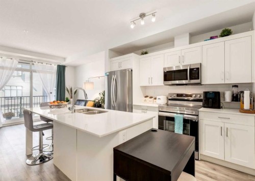 311-30 Sage Hill Nw, Calgary, AB - Indoor Photo Showing Kitchen With Stainless Steel Kitchen With Double Sink With Upgraded Kitchen
