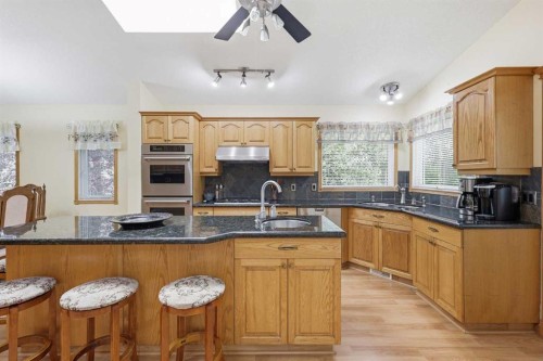 535 Cimarron Point, Okotoks, AB - Indoor Photo Showing Kitchen With Double Sink
