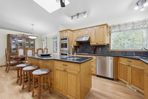 535 Cimarron Point, Okotoks, AB - Indoor Photo Showing Kitchen With Double Sink