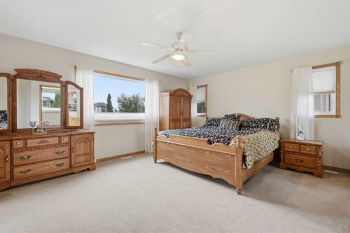535 Cimarron Point, Okotoks, AB - Indoor Photo Showing Bedroom