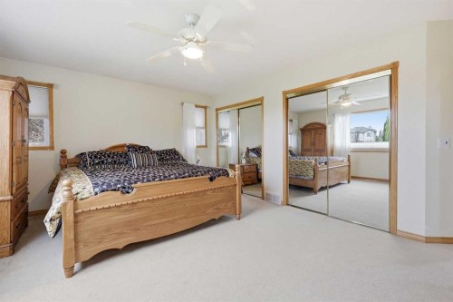 535 Cimarron Point, Okotoks, AB - Indoor Photo Showing Bedroom