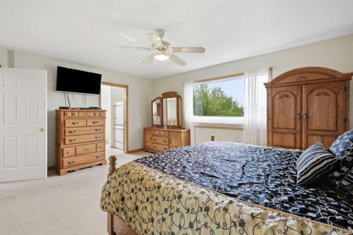 535 Cimarron Point, Okotoks, AB - Indoor Photo Showing Bedroom