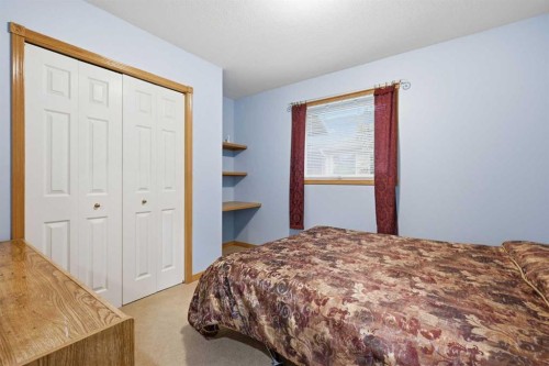 535 Cimarron Point, Okotoks, AB - Indoor Photo Showing Bedroom