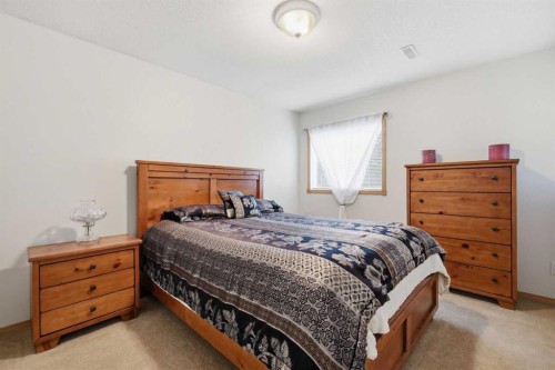 535 Cimarron Point, Okotoks, AB - Indoor Photo Showing Bedroom