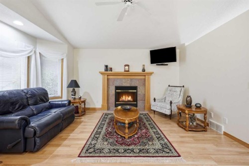 535 Cimarron Point, Okotoks, AB - Indoor Photo Showing Living Room With Fireplace