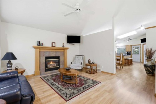 535 Cimarron Point, Okotoks, AB - Indoor Photo Showing Living Room With Fireplace