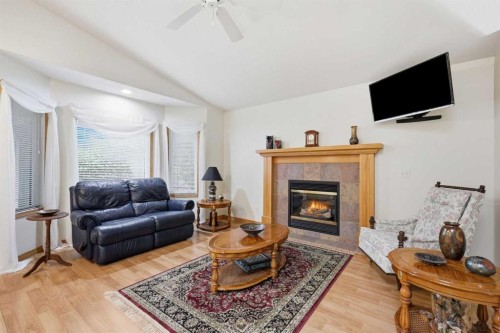 535 Cimarron Point, Okotoks, AB - Indoor Photo Showing Living Room With Fireplace