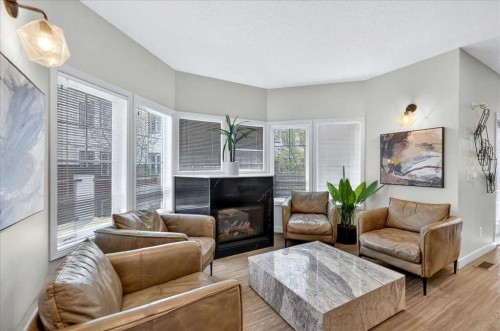 303-70 Royal Oak Plaza Nw, Calgary, AB - Indoor Photo Showing Living Room With Fireplace