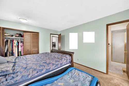 11 Rundlemere Place Ne, Calgary, AB - Indoor Photo Showing Bedroom