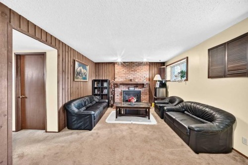 11 Rundlemere Place Ne, Calgary, AB - Indoor With Fireplace