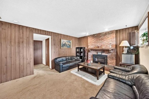 11 Rundlemere Place Ne, Calgary, AB - Indoor Photo Showing Living Room With Fireplace