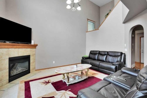 49 Saddletree Close Ne, Calgary, AB - Indoor Photo Showing Living Room With Fireplace