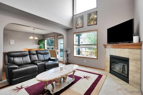 49 Saddletree Close Ne, Calgary, AB - Indoor Photo Showing Living Room With Fireplace