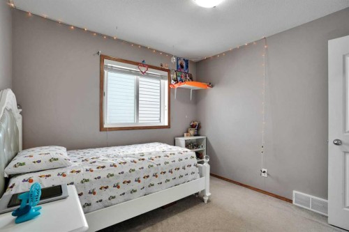 49 Saddletree Close Ne, Calgary, AB - Indoor Photo Showing Bedroom