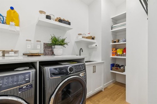 2543 Chicoutimi Drive Nw, Calgary, AB - Indoor Photo Showing Laundry Room